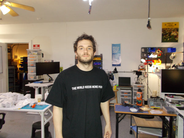THE WORLD NEEDS MORE IPODS Heavyweight Cotton T-Shirt